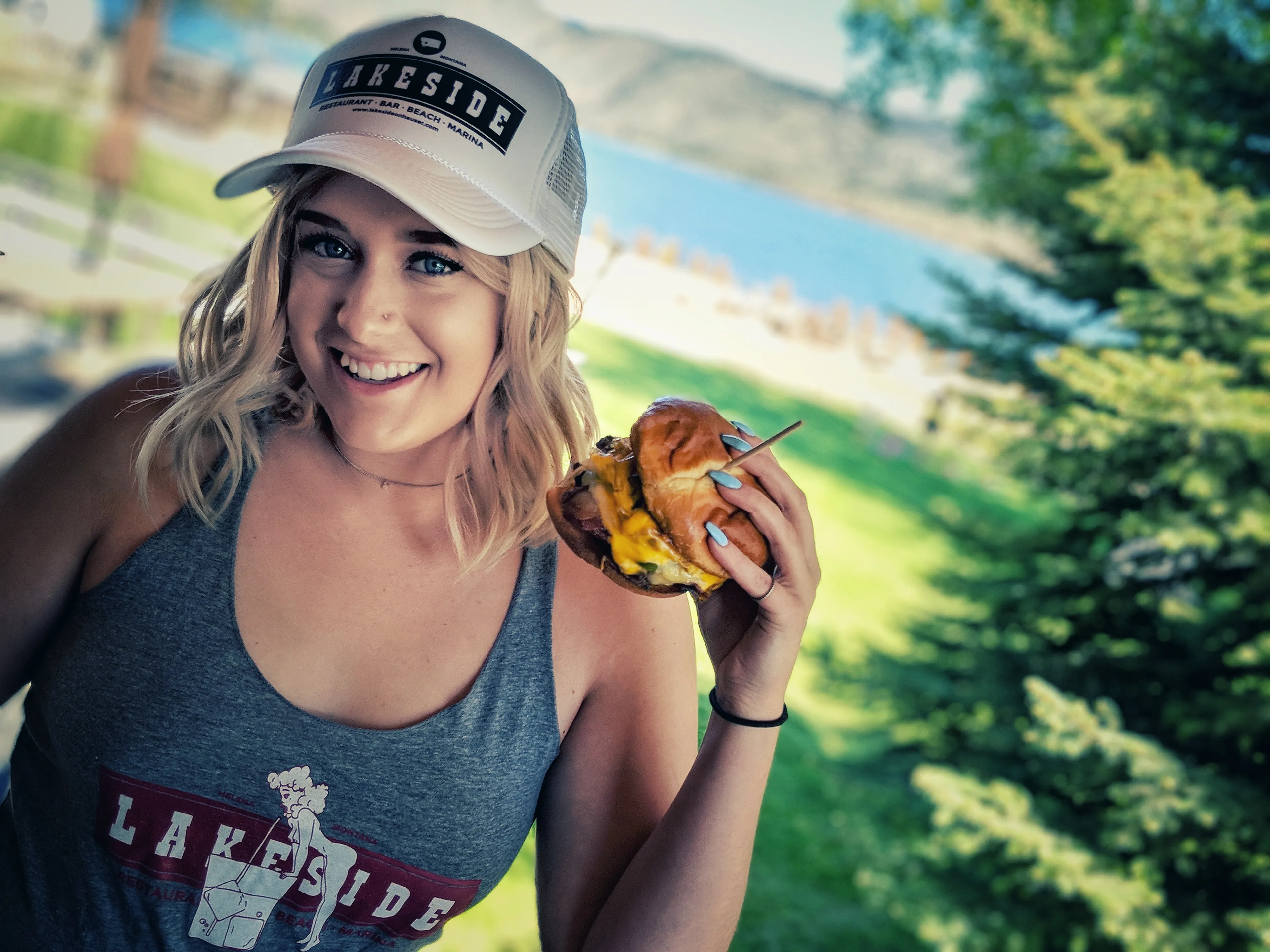 Customer wearing a Lakeside hat and tank top